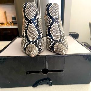 Aldo size 7 snake skin slip on Mules 3.75 heel.